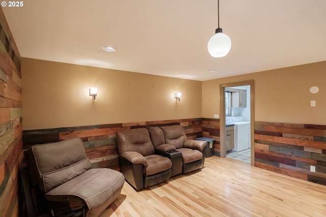 4635 18th Pl S, Salem, OR 97302 - living room featuring washer / clothes dryer, wainscoting, and light wood-type flooring