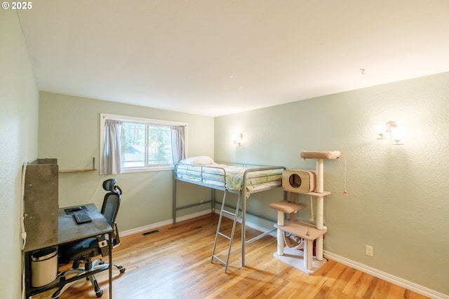 4635 18th Pl S, Salem, OR 97302 - bedroom with wood finished floors, a desk, and baseboards