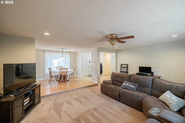 4635 18th Pl S, Salem, OR 97302 - living room with recessed lighting, light carpet, a textured ceiling, a ceiling fan, and light wood-style flooring