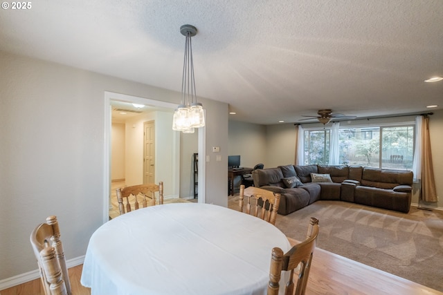 4635 18th Pl S, Salem, OR 97302 - dining area with light wood-type flooring, a textured ceiling, a ceiling fan, recessed lighting, and baseboards