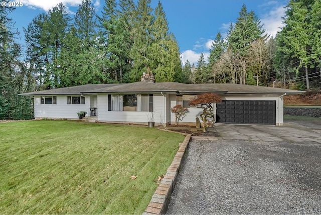 single story home featuring a front yard and a garage