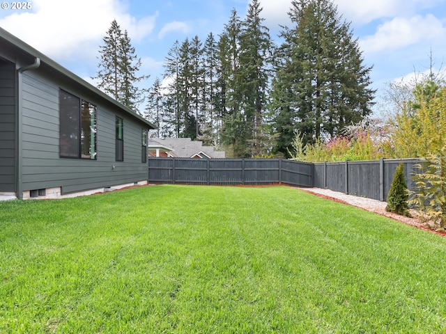 view of yard with a fenced backyard