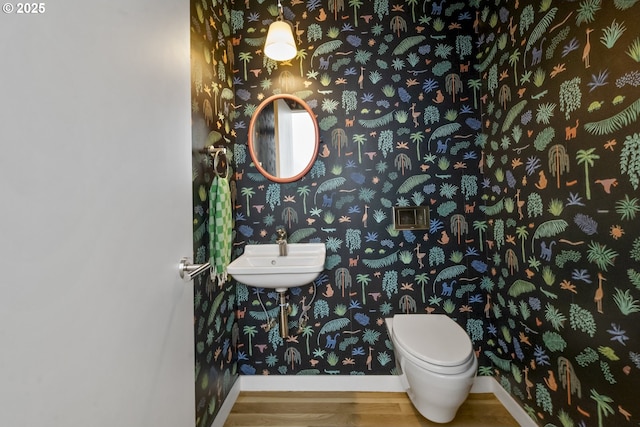 3419 SE Woodward St, Portland, OR 97202 - half bathroom with wallpapered walls and wood finished floors