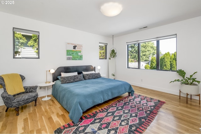 3419 SE Woodward St, Portland, OR 97202 - bedroom with wood finished floors and baseboards