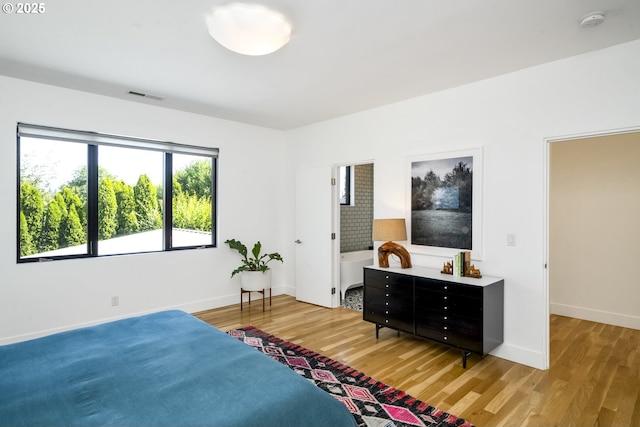 3419 SE Woodward St, Portland, OR 97202 - bedroom featuring light wood finished floors