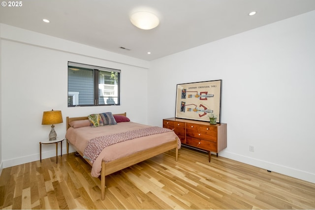 3419 SE Woodward St, Portland, OR 97202 - bedroom with light wood-style flooring and recessed lighting