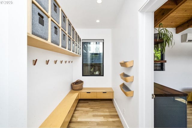 3419 SE Woodward St, Portland, OR 97202 - mudroom featuring wood finished floors, recessed lighting, and a wall mounted air conditioner