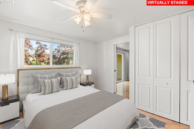 4071 Donald St Unit E, Eugene, OR 97405 - bedroom featuring light wood-style floors, a closet, and a ceiling fan