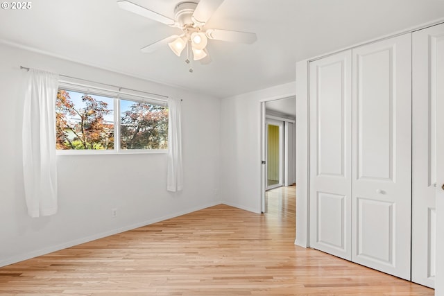 4071 Donald St Unit E, Eugene, OR 97405 - unfurnished bedroom with light wood-type flooring, a closet, and ceiling fan