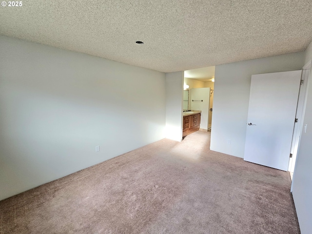 950 Evergreen Rd Unit 207, Woodburn, OR 97071 - spare room featuring light colored carpet and a textured ceiling