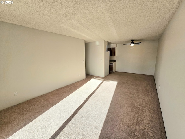 950 Evergreen Rd Unit 207, Woodburn, OR 97071 - unfurnished room with light colored carpet, ceiling fan, and a textured ceiling