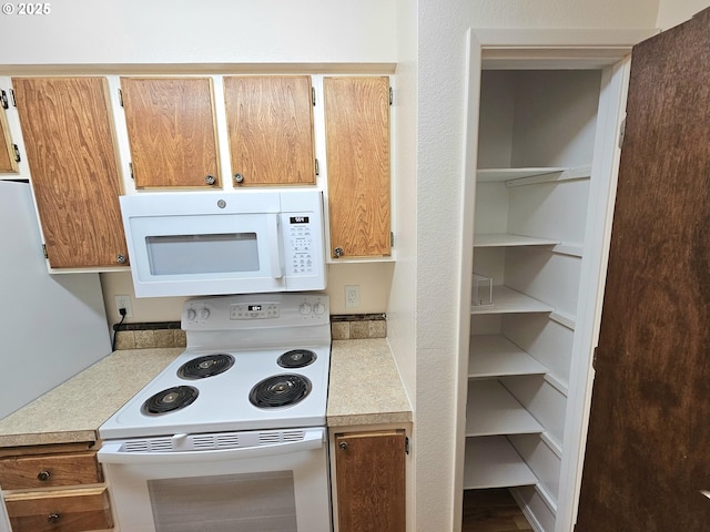 950 Evergreen Rd Unit 207, Woodburn, OR 97071 - kitchen featuring white appliances and light countertops