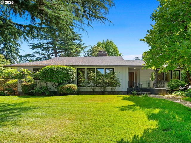 3440 SW 100th Ave, Portland, OR 97225 - single story home with a front yard, a chimney, and roof with shingles