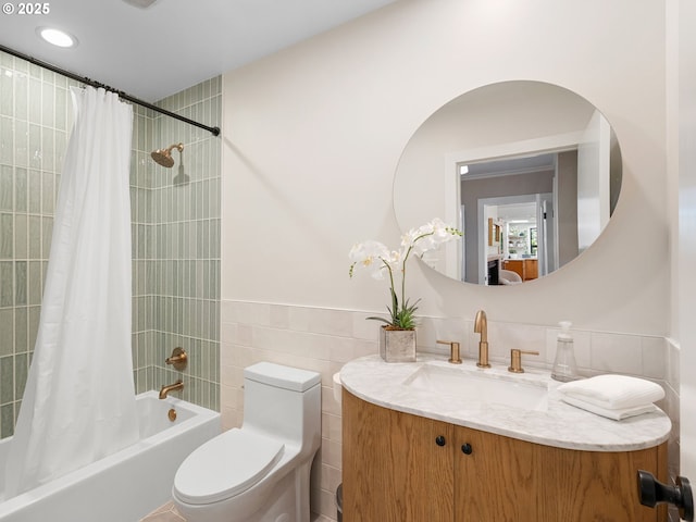 3440 SW 100th Ave, Portland, OR 97225 - bathroom with tile walls, vanity, shower / tub combo, and wainscoting