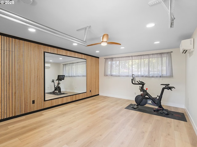 3440 SW 100th Ave, Portland, OR 97225 - workout area with wood finished floors, a ceiling fan, recessed lighting, and a wall unit AC
