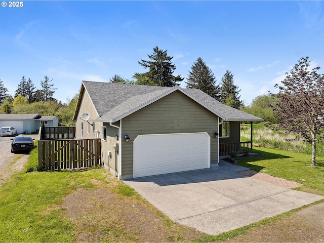 view of property exterior with a lawn, a garage, roof with shingles, and driveway