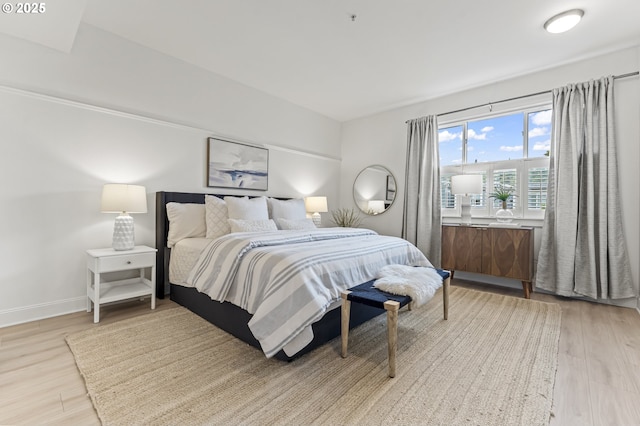 bedroom with light wood-type flooring