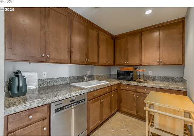 kitchen featuring dishwasher, light tile patterned flooring, and sink