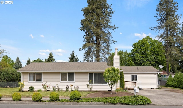 single story home with a chimney