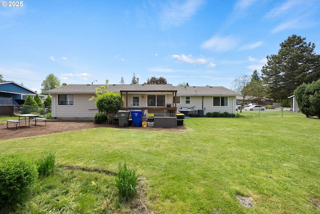 rear view of house featuring a deck