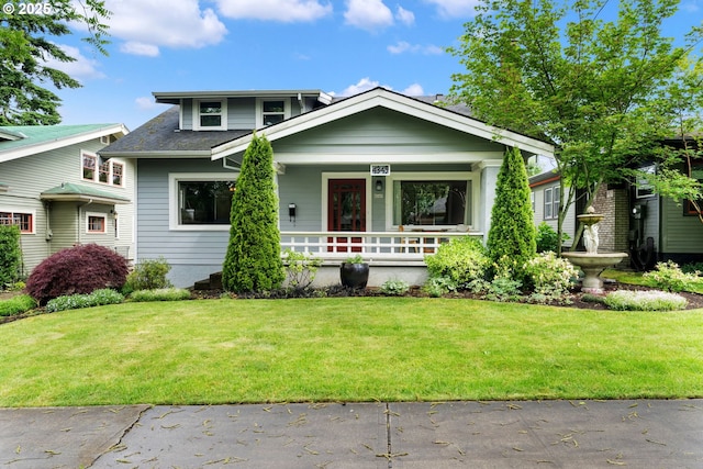 4349 NE Glisan St, Portland, OR 97213 - bungalow-style home with covered porch, a front lawn, and roof with shingles
