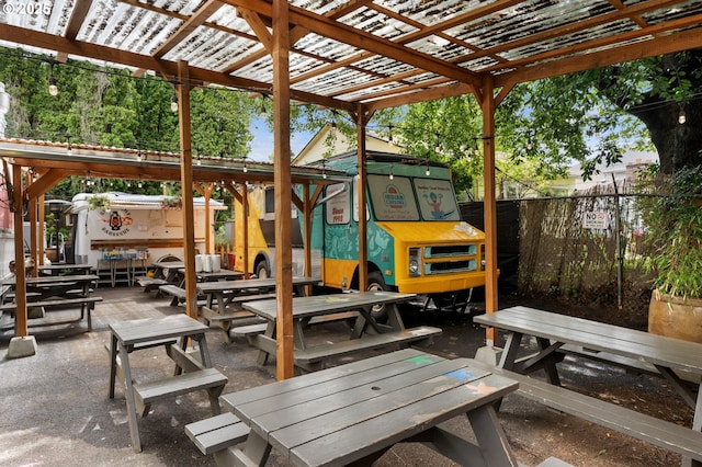 4349 NE Glisan St, Portland, OR 97213 - view of patio featuring fence, outdoor dining area, and a pergola