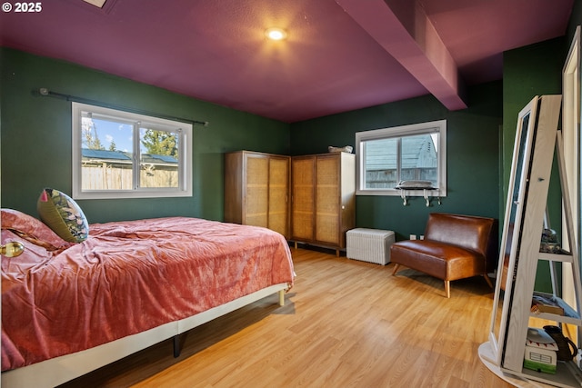 bedroom with wood finished floors