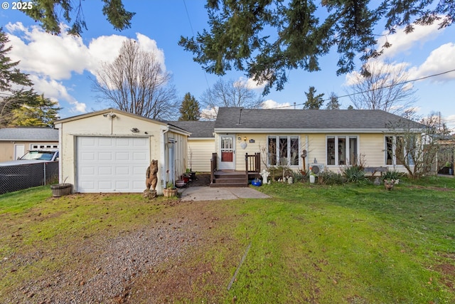 ranch-style home with a front yard, fence, and driveway