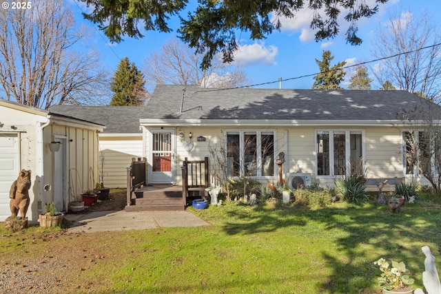 rear view of house with board and batten siding, ac unit, a shingled roof, and a lawn