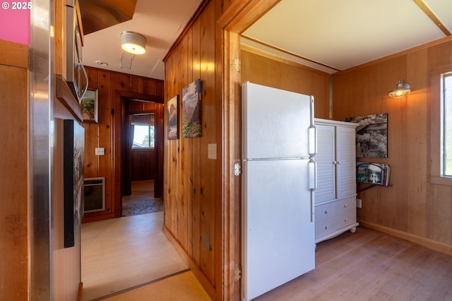 3720 NW Keel Ave, Lincoln City, OR 97367 - corridor featuring wooden walls, light wood-style flooring, and baseboards