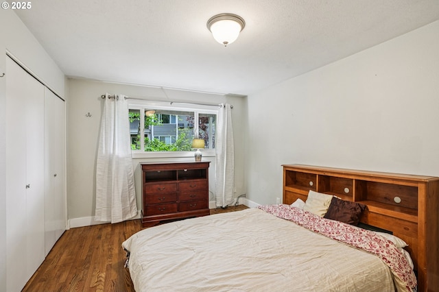6610 SW Terri Ct Unit 10, Portland, OR 97225 - bedroom with a closet and wood finished floors