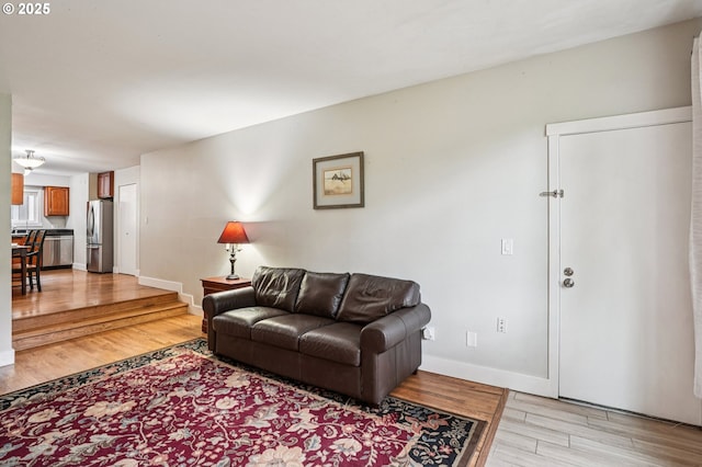 6610 SW Terri Ct Unit 10, Portland, OR 97225 - living area featuring light wood-style floors and baseboards