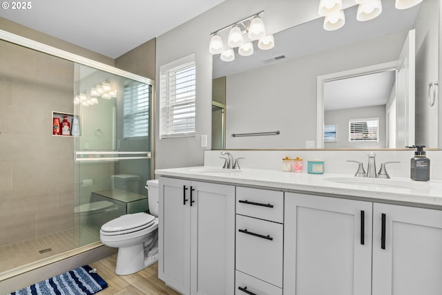 5820 El Mar Ave, Lincoln City, OR 97367 - bathroom featuring double vanity, toilet, healthy amount of natural light, and a shower stall