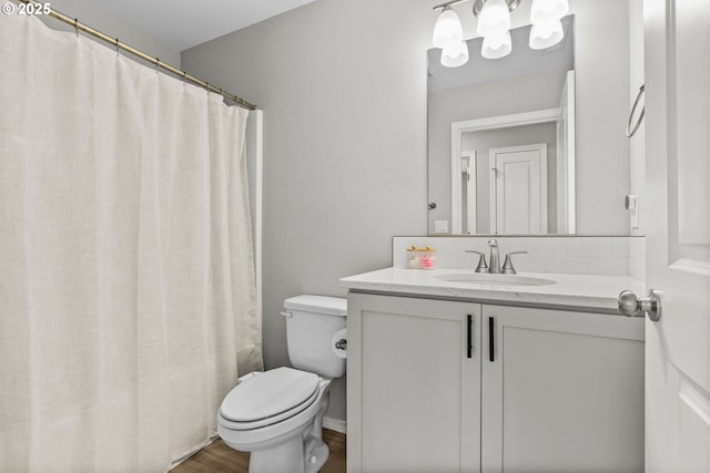 5820 El Mar Ave, Lincoln City, OR 97367 - full bathroom with vanity, toilet, a shower with curtain, and wood finished floors