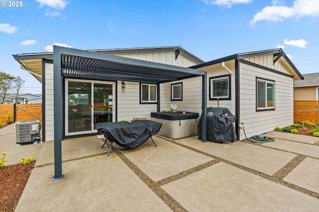 5820 El Mar Ave, Lincoln City, OR 97367 - rear view of property with board and batten siding, cooling unit, and a patio