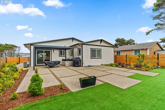 5820 El Mar Ave, Lincoln City, OR 97367 - back of house with board and batten siding and a patio