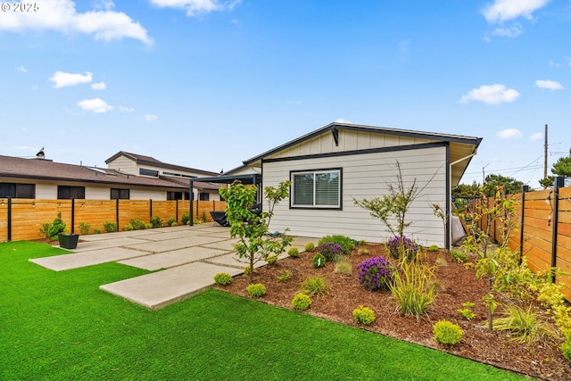 5820 El Mar Ave, Lincoln City, OR 97367 - back of house with a patio and board and batten siding