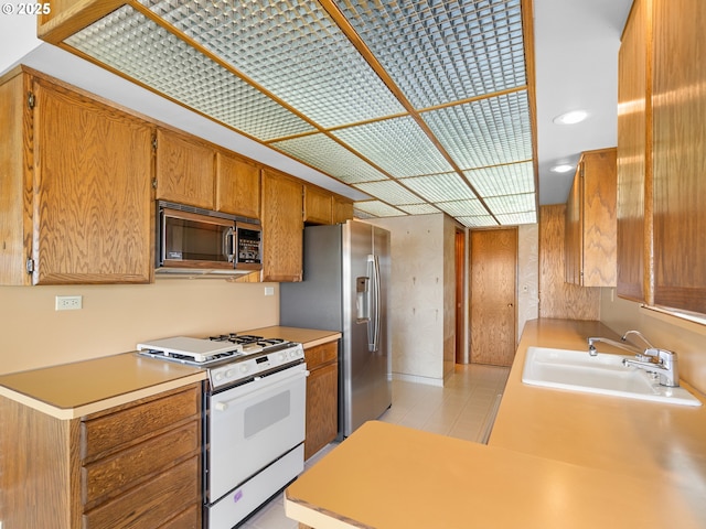 6002 E Evergreen Blvd, Vancouver, WA 98661 - kitchen with appliances with stainless steel finishes, brown cabinetry, and light countertops