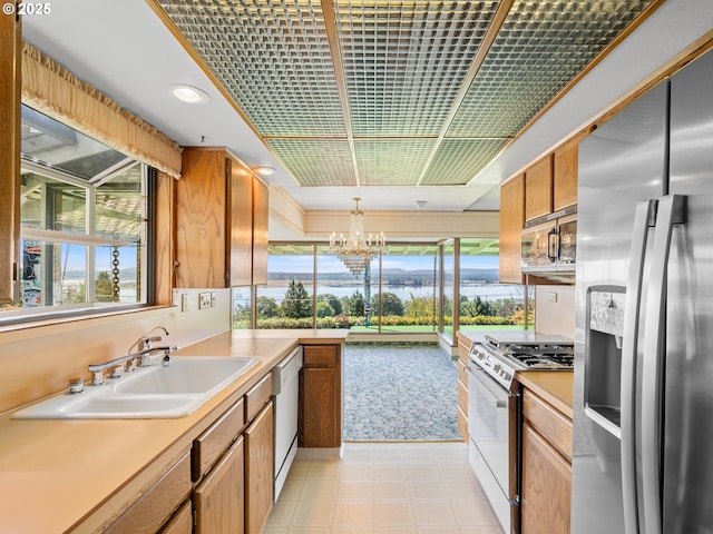 6002 E Evergreen Blvd, Vancouver, WA 98661 - kitchen with white appliances, plenty of natural light, a chandelier, and recessed lighting