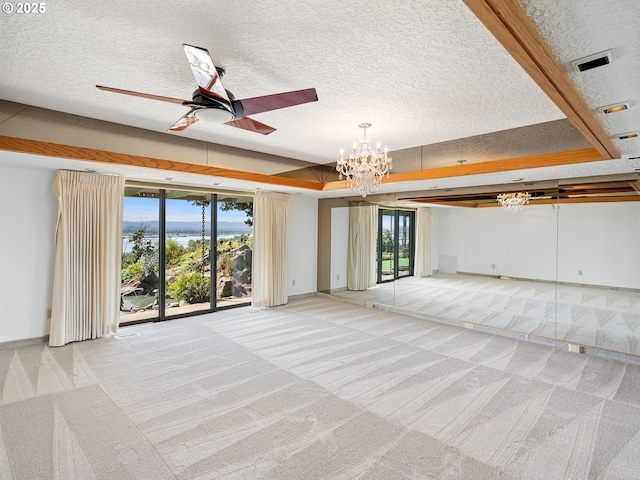 6002 E Evergreen Blvd, Vancouver, WA 98661 - unfurnished living room with a chandelier, light carpet, a ceiling fan, and a textured ceiling