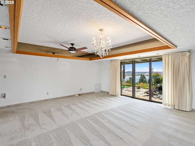 6002 E Evergreen Blvd, Vancouver, WA 98661 - spare room featuring light carpet, a water view, a textured ceiling, a chandelier, and a ceiling fan