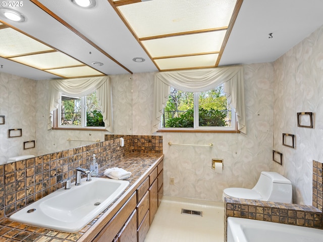 6002 E Evergreen Blvd, Vancouver, WA 98661 - full bath with vanity, a tub, and tasteful backsplash
