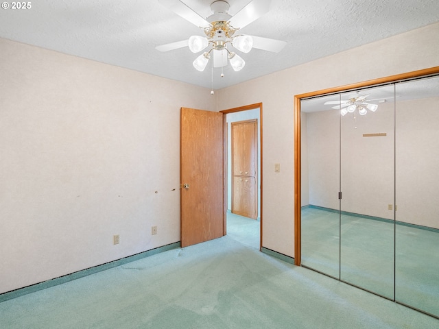 6002 E Evergreen Blvd, Vancouver, WA 98661 - unfurnished bedroom with carpet flooring, a closet, a ceiling fan, and a textured ceiling