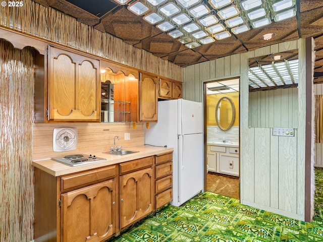 6002 E Evergreen Blvd, Vancouver, WA 98661 - kitchen with freestanding refrigerator, electric stovetop, light countertops, wooden walls, and backsplash