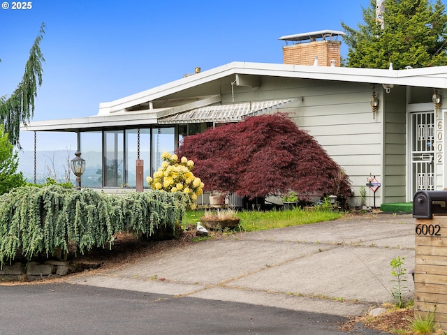 6002 E Evergreen Blvd, Vancouver, WA 98661 - view of side of home with a chimney