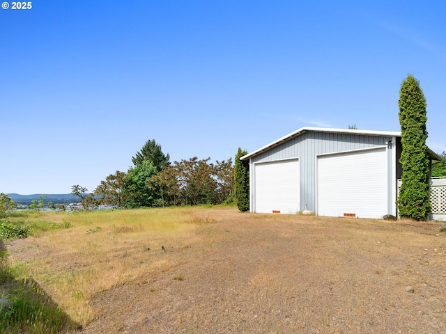 6002 E Evergreen Blvd, Vancouver, WA 98661 - view of yard featuring a detached garage and an outdoor structure