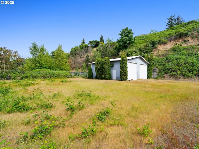 6002 E Evergreen Blvd, Vancouver, WA 98661 - view of yard with a detached garage and an outdoor structure