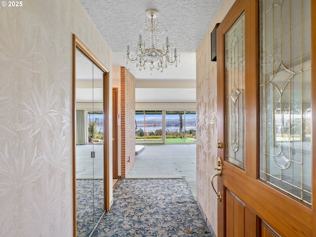 6002 E Evergreen Blvd, Vancouver, WA 98661 - carpeted foyer featuring a chandelier and a textured ceiling
