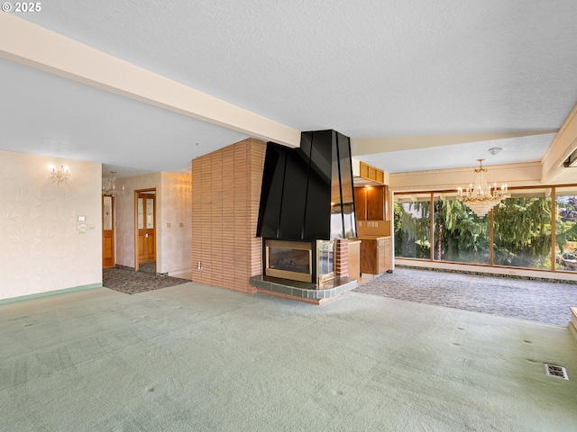 6002 E Evergreen Blvd, Vancouver, WA 98661 - unfurnished living room featuring a chandelier, a fireplace, carpet, plenty of natural light, and wallpapered walls