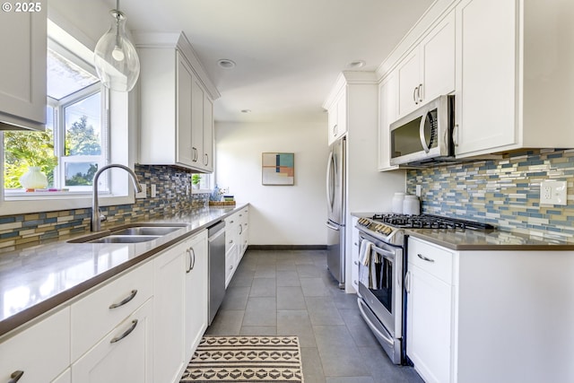 6220 SW 45th Ave, Portland, OR 97221 - kitchen featuring appliances with stainless steel finishes, a sink, decorative backsplash, white cabinets, and recessed lighting